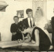 Outro instante da celebração do casamento no Civil, de Arno Ervino Ritter e Nercy Koch. 
Da esquerda a direita:   1ª -cartorário Willy Carlos Trentini; 2ª - empresário Hedo Schneider, padrinho de casamento do noivo; 3ª - Erna  Ritter; 4ª - noivo Arno Ritter; 5ª - noiva Nercy Koch;  6ª - Plínio Ritter, irmão do noivo; 7ª - Helmuth Koch;  e 8ª - Aida Schneider, madrinha de casamento assinando o  livro de assentamento. 