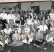 Jovens pioneiros rondonenses em comoração carnavalesca no antigo Clube Aliança, localizado no centro da cidade de Marechal Cândido Rondon. Na foto, ao fundo, em pé, da esquerda à direita: 7ª pessoa - Auri Zart. Sentados, na primeira fila: 4ª pessoa é Ilário Kehl (Alemão Louco), locutor de rádio. Atrás dele, sentado, é Zeno Kempfer (camiseta branca e barbicacho). Demais não identificados.