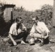 O pioneiro Alfredo Bausewein e um amigo nos anos de 1958/59. 
Ao fundo, a famigerada casinha sanitária (capunga), para as necessidades fisiológicas. 
